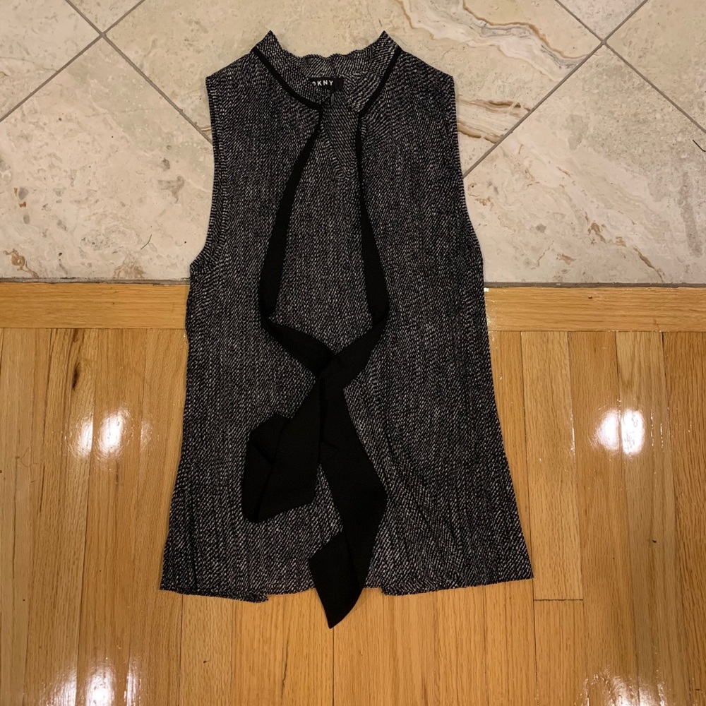 Black and white sleeveless v neck blouse